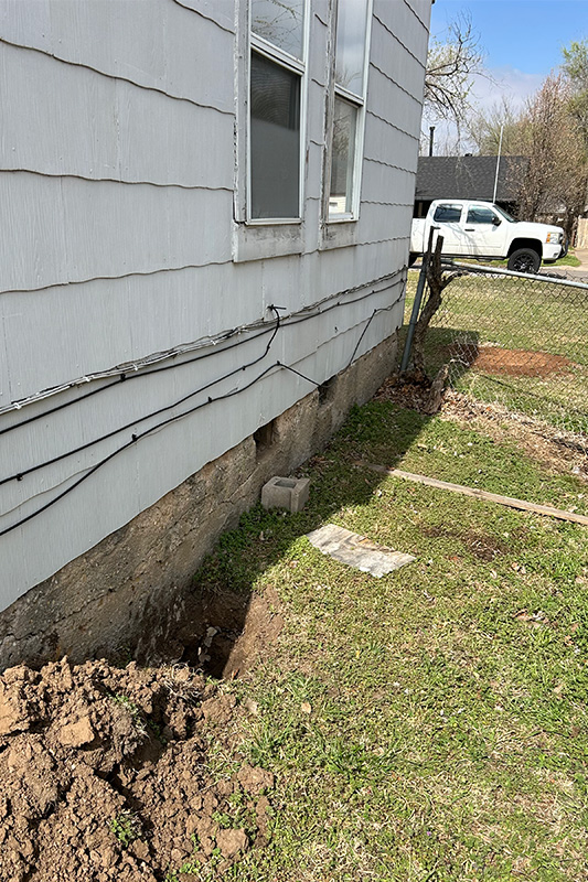 House with worn and damaged raised foundation